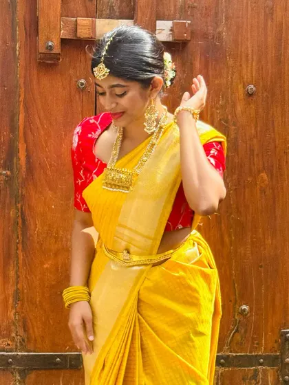 Embracing the vibrant energy of Day 1 of Navratri in this stunning yellow saree. The color of joy and positivity to light up the divine nights.