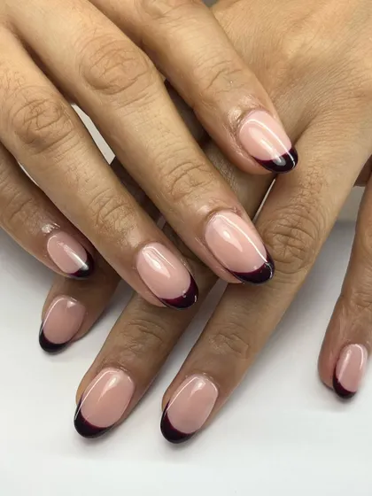 Simple, elegant, and a little bit dramatic. A deep, dark wine-colored tip gives this classic French manicure a sophisticated and modern edge.