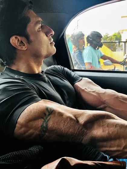 A relaxed but powerful arm shot. My coaching helps you build muscle that is impressive even when you're not flexing.