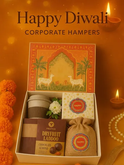 This is our classic take on a corporate Diwali hamper. It’s designed to feel festive yet professional, filled with treats like dry fruit laddoos and a reusable coffee mug, making it a perfect gift for employees and clients.