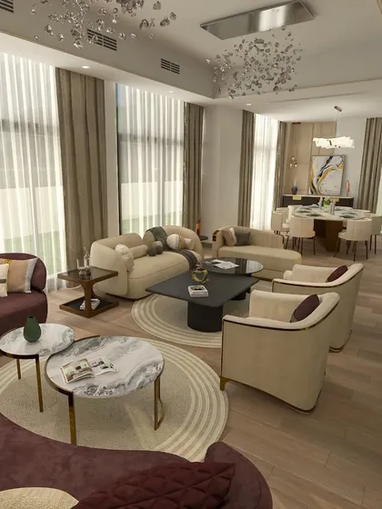 For a client in Dubai, I designed this luxurious drawing room with rich wooden flooring and a mix of beige and wine-colored upholstered sofas for a refined feel.
