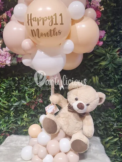 A personalized teddy bear balloon bouquet celebrating 11 months, showcasing how we can mark every little milestone.