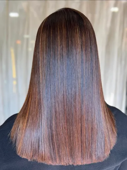 The stunning transformation of lovely brown locks after our Botox treatment. The hair now boasts a glossy, lustrous finish that's completely frizz-free.