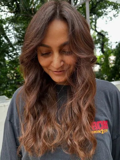 Getting her ready for a work trip with my 'Almond Brown' tresses. This look is professional, stylish, and easy to manage while traveling.