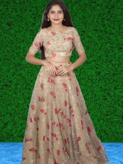 This beige lehenga set is adorned with beautiful red floral embroidery, offering a delicate and romantic look for your special event.