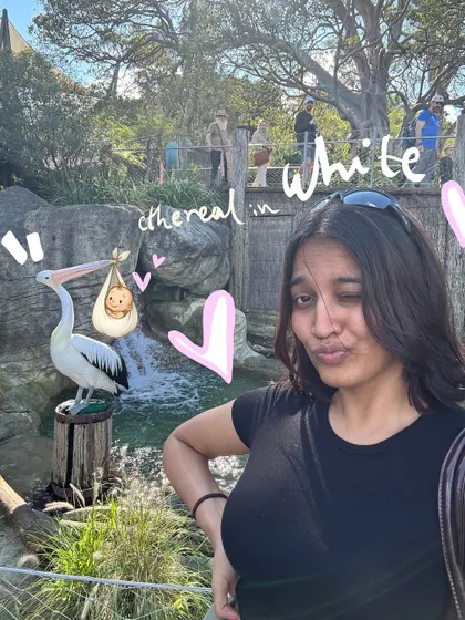 A wink for the camera at the zoo, with some cute hearts and text doodles to add to the playful vibe.