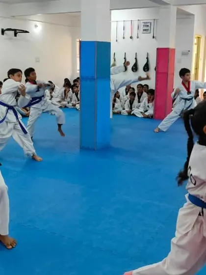 Students practicing their forms during a belt exam.