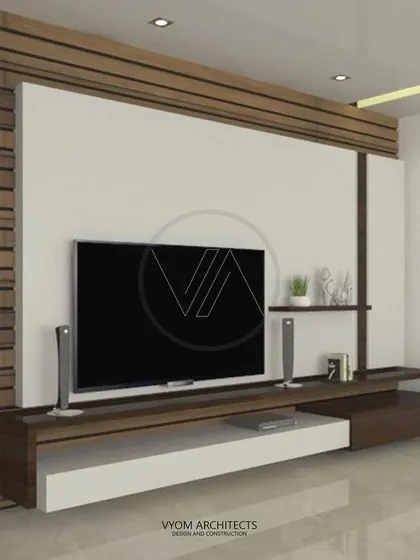 A custom-designed TV cabinet unit that combines open shelves and closed storage. The mix of white and wood finishes creates a clean, contemporary look that is integrated with the wall paneling.