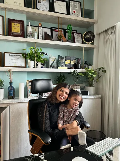 A moment with my daughter in my office. Being a mom is the best job in the world, and I'm always navigating the beautiful rollercoaster of balancing work and family.
