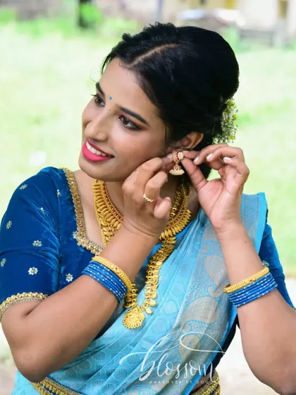 This candid shot shows how a perfect drape allows for natural, beautiful moments. The client is adjusting her earring, comfortable and confident in her look.