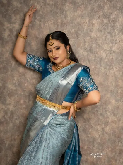 The movement and fall of a saree are so important. This shot captures the beautiful drape of the silk, complemented by the perfectly fitted embroidered blouse.