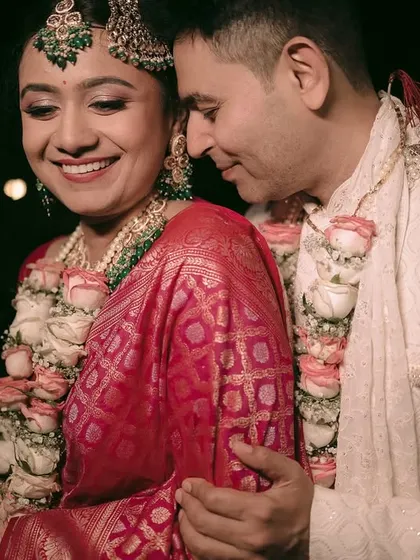 A tender moment between the couple after their nighttime wedding ceremony.