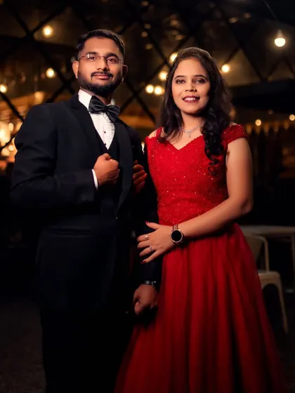 A classic portrait of a beautiful couple. The bride's off-shoulder red ball gown and the groom's tuxedo are a timeless combination for a pre-wedding shoot.
