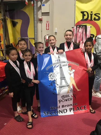 The Bronze team with their 2nd place banner, celebrating a fantastic final regular season meet.