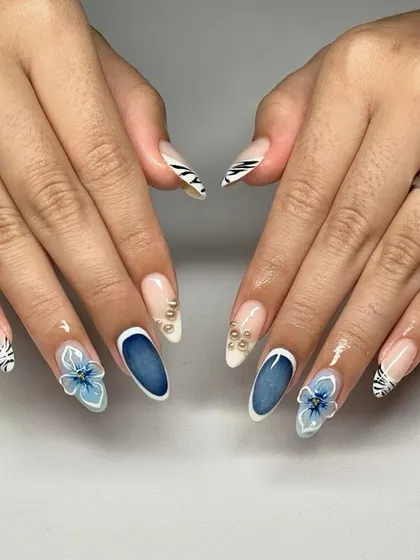A sophisticated design featuring a deep blue cat-eye effect, translucent 3D flowers, and delicate pearl accents. This set perfectly balances modern trends with classic beauty.
