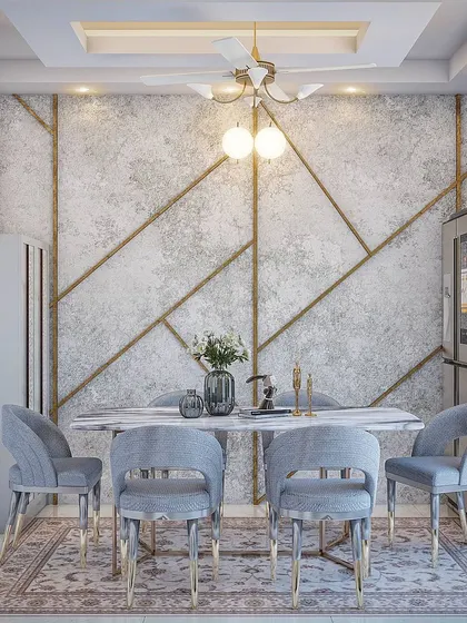 A formal dining room concept featuring a textured accent wall with geometric gold inlays. The marble dining table and plush grey chairs with chrome legs add a touch of modern glamour.