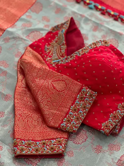 A close-up of the brocade sleeve and embroidery.