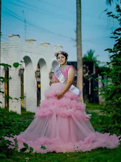 Our pink ruffle gown is a sweet and popular choice for baby showers and maternity shoots. It looks beautiful in outdoor garden settings.