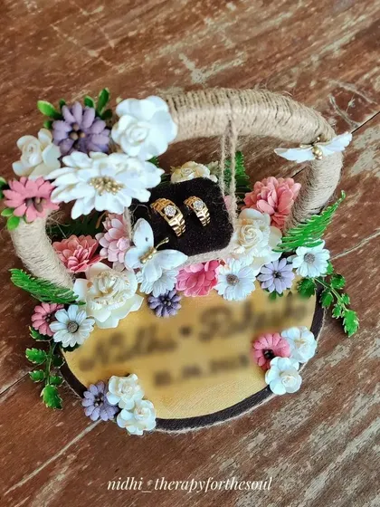 A closer look at the designer ring platter, showing the details of the rings nestled among the flowers. It was a pleasure to create something for such a happy occasion.