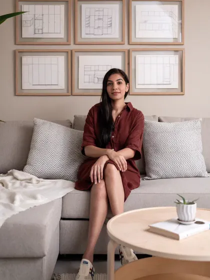 A personal photo of me in the 'Rooted Japandi Home,' a project that was challenging but incredibly rewarding. The client's reaction to the transformation made all the hard work worth it.