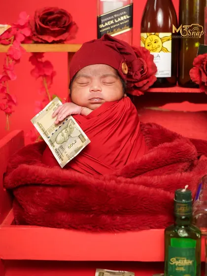 This little one is already a boss! A fun and quirky theme featuring play money and a "Black Label" prop for a good laugh.