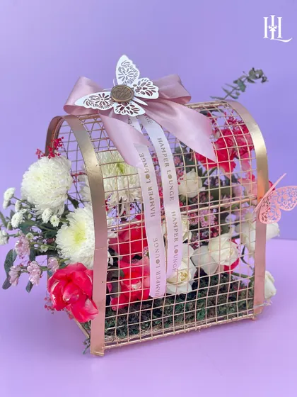 A fresh floral hamper is a perfect Valentine's surprise. This arrangement, presented in a beautiful rose gold metal birdcage, is a unique and timeless way to show your love.