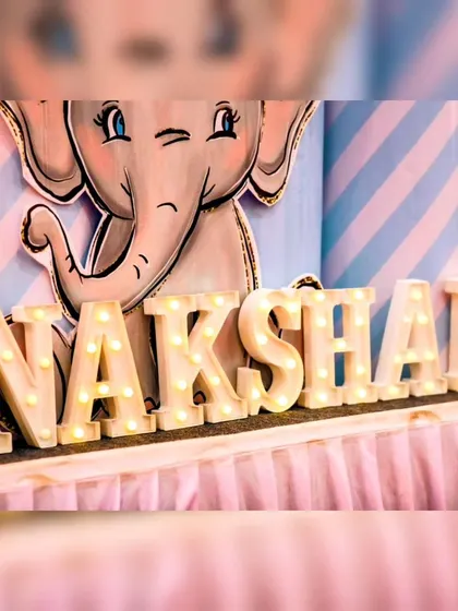 Personalized marquee letters are a great way to highlight the birthday child's name. Here they are used in Nakshan's elephant-themed party.