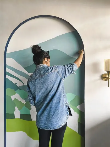 Adding layers of green to create depth in the landscape. The arch frames give it a window-like feel.