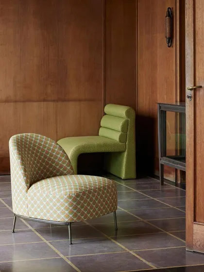 The 'Vanity' and 'Zig Zag' chairs from Nobilis showcase a striking interplay of bold lines and geometric forms. The vibrant green and patterned fabrics demonstrate how upholstery can be used to create sculptural and artistic statements.