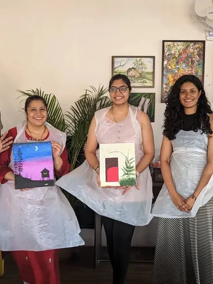 A group of happy painters showing off their finished canvases. It's always great to see the different interpretations of the same theme.