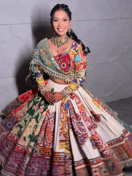 The joy of movement. Her colorful lehenga and festive makeup come to life as she twirls.