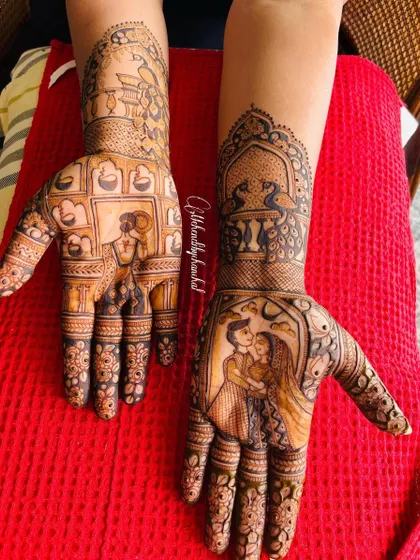 A full view of the Karwa Chauth story mehendi, with a couple portrait on one hand and a woman performing the festival rituals on the other.