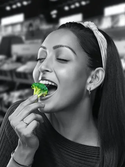 This shot for GoFresh features broccoli as the pop of color. The model's headband and simple top give her a fresh, youthful look.