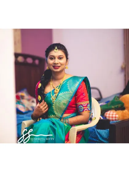 I had so much fun getting my friend ready for her engagement. This look features a beautiful teal and red saree, complemented by soft makeup with a bold red lip.