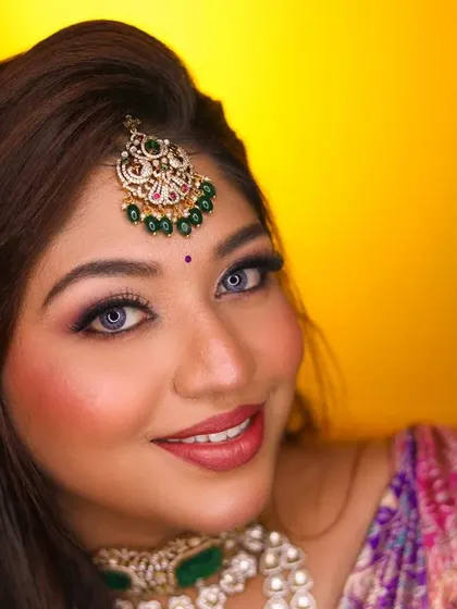 A close-up bridal portrait showing off her beautiful smile and sparkling eyes.