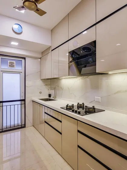 Another angle of the cooking area, highlighting the sleek black appliances.