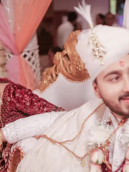 A candid moment during the wedding ceremony. The bride's happy glance towards her groom tells a beautiful story.