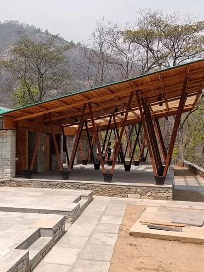 **Angling Centre, Pancheshwar:** The completed pavilion and terrace provide a platform for community gathering and tourism. The design combines local materials like stone and wood with a modern structural form, creating a unique landmark for the region.