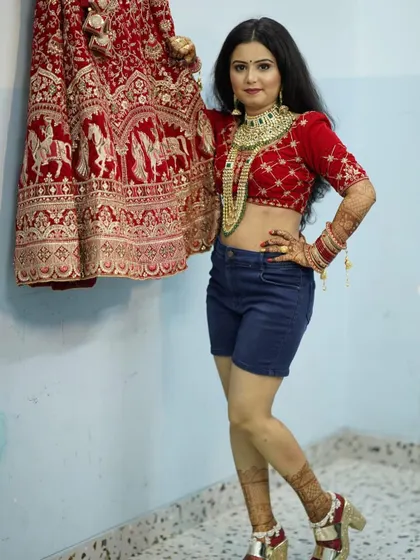 Our bride is all smiles, rocking her bridal blouse and jewelry with a pair of shorts before the main event. This shows the fun and relaxed atmosphere we create.
