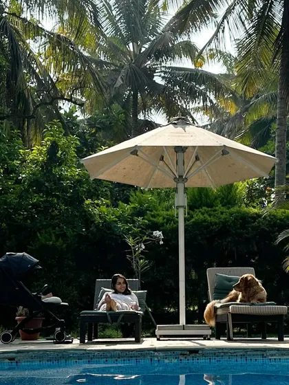 Finding our peace. A quiet moment by the pool with my baby in his stroller and my dog relaxing on her own lounge chair. This is what a well-managed, happy family life can look like.