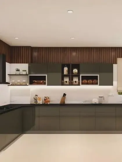 This U-shaped kitchen uses dark, glossy cabinets and a wood-paneled accent wall. The layout provides a generous amount of counter space for cooking and prep.