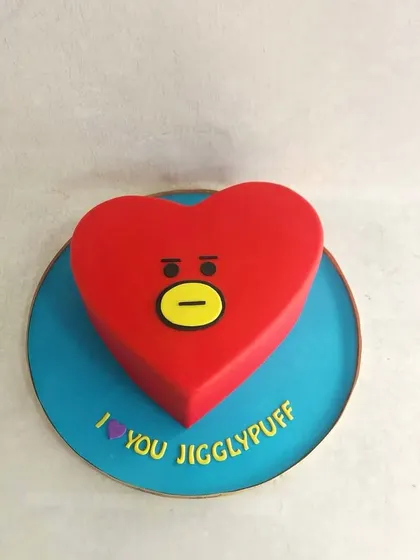 A simple but very cute heart-shaped cake, inspired by the BT21 character Tata. Perfect for a K-pop fan.