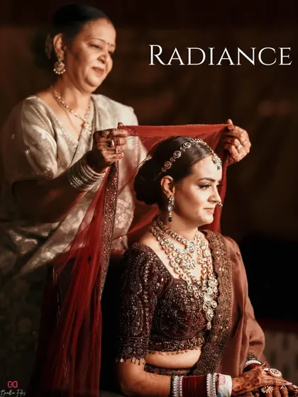 A touching moment between the bride and her mother, who helps adjust her veil. A beautiful portrait of family love and tradition.