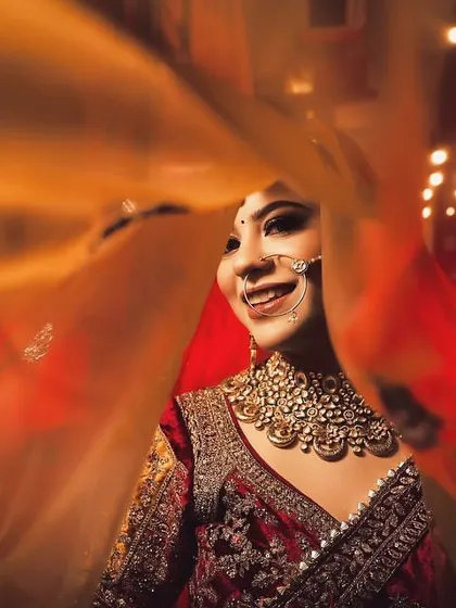An artistic and dynamic bridal portrait using a slow shutter speed to capture the motion of her veil. This creative technique results in a unique and ethereal image.