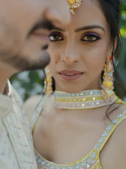 An intense and captivating close-up portrait of the bride. The focus on her eyes creates a powerful and emotional connection with the viewer.