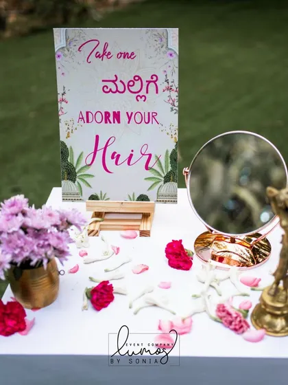 A closer view of the jasmine flower station, with a mirror and traditional brass elements.