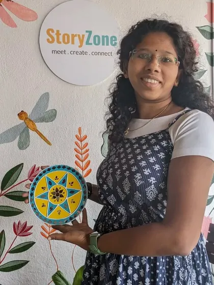 A participant with her finished Lippan art piece, another beautiful and meditative craft we offer.