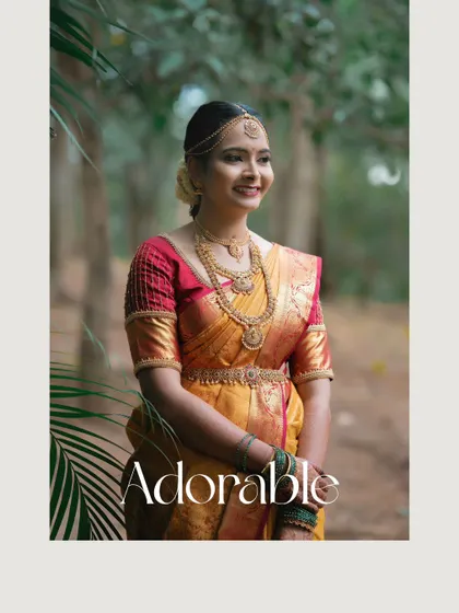 An adorable portrait of the bride in her beautiful silk saree, captured in the soft, natural light of the outdoors.