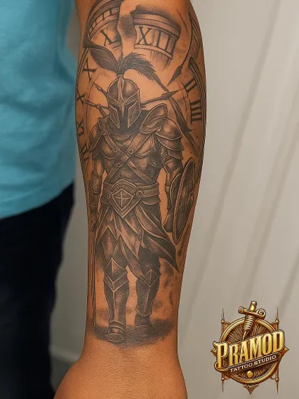 A powerful forearm sleeve featuring a Spartan warrior against a backdrop of a clock. This tattoo symbolizes strength, courage, and the timeless spirit of a fighter.