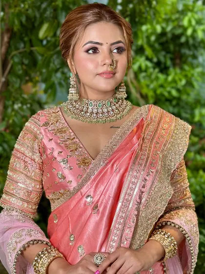 A closer view of the soft, peachy eye makeup and luminous skin that defines this modern Maharashtrian bridal look.